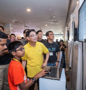 Code in the Community graduate Ramakrishnan Sanjit presenting his project to DPM Heng Swee Keat (Image courtesy of Google)
