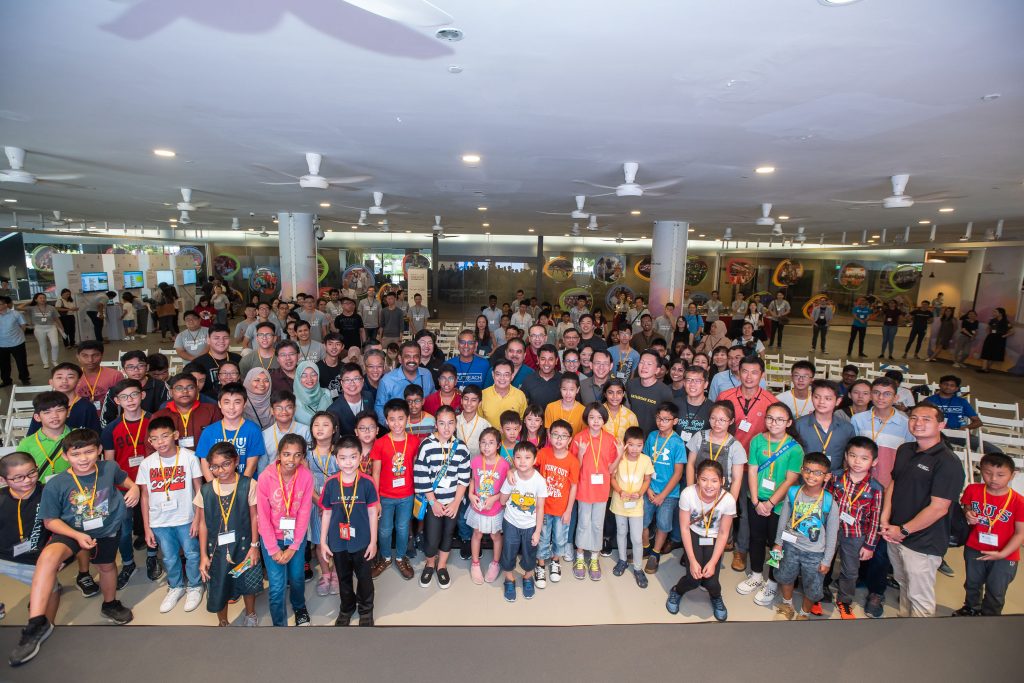 DPM Heng Swee Keat with the partners and graduates of Code in the Community (Image courtesy of Google)